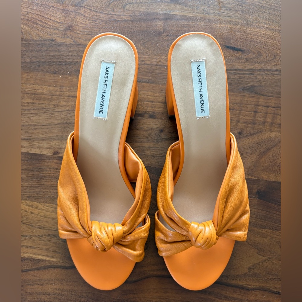 Orange heels. Saks fifth Avenue. Never worn!